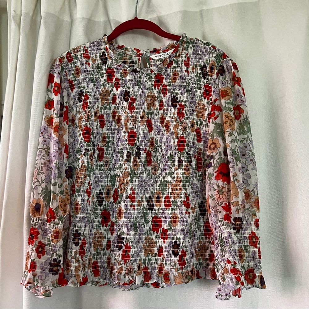 Veronica Beard Kali smocked blouse. Long sleeve with smocked bodice and cuffs.
